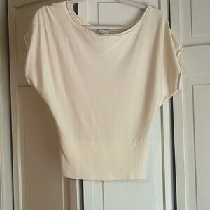 Butter yellow/cream shortsleeve knit top boatneck and a ribbed, cinched waist.